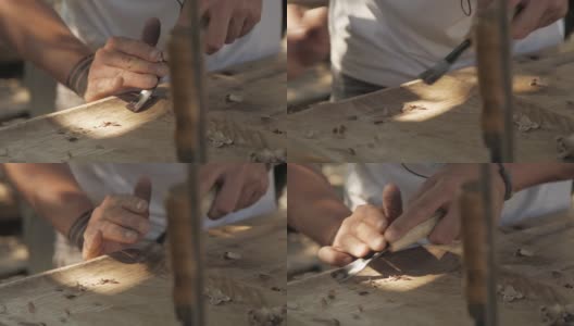 木雕师用凿子加工胡桃木板。工匠在做一个茶盘高清在线视频素材下载