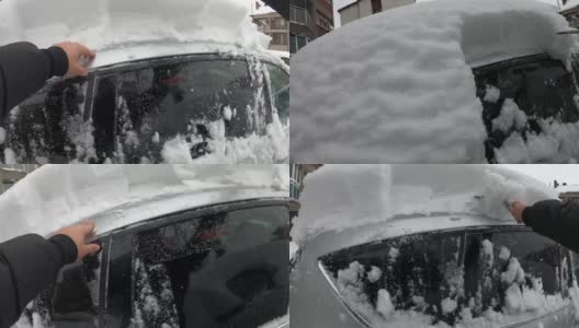 清理挡风玻璃——一名男子正在清理袭击他汽车的大雪，这张照片是用GoPro相机拍摄的高清在线视频素材下载