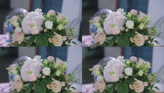 美妙美丽的鲜花站在桌子上装饰活动。镜头移动平稳高清在线视频素材下载