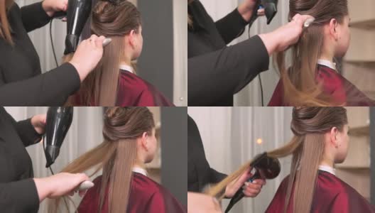理发师用吹风机和梳子为女士吹干长直发。高清在线视频素材下载