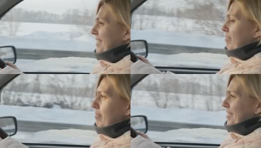 可爱的欧洲女人在一个冬天阳光明媚的日子里开车高清在线视频素材下载
