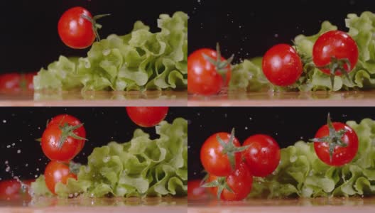 宏观:鲜红色的番茄落下，落在潮湿的长叶莴苣叶子上。高清在线视频素材下载