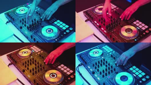 DJ双手扭来扭去，按下DJ遥控器上不同的按钮，俱乐部里的音乐颜色和轻音乐。与dj派对高清在线视频素材下载