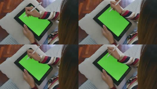 女商人用数字笔在绿色屏幕上写笔记高清在线视频素材下载