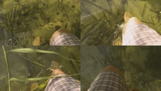 赤脚在湖水中行走高清在线视频素材下载