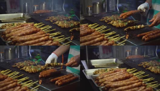 慢动作卖主烹饪台湾鸡棒。夜市街道。高清在线视频素材下载