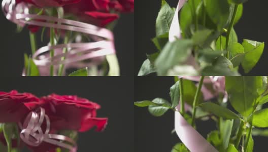 红玫瑰花束旋转特写。黑色背景上的一束红玫瑰。高清在线视频素材下载