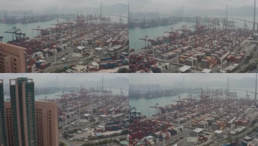 无人机俯视图Pan上方移动的集装箱货船在港口与进出口业务和国际物流航运在城市的货物。吊车在香港维多利亚港的移动速度为4k高清在线视频素材下载