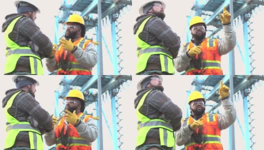 两个工人在港口聊天高清在线视频素材下载