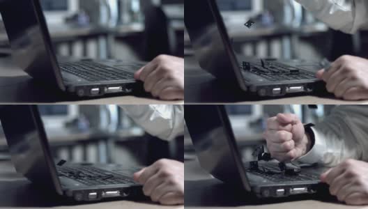 商人用拳头砸笔记本电脑，慢动作高清在线视频素材下载