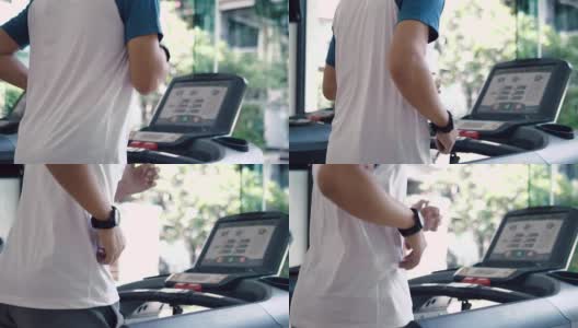 人们在健身房的跑步机上做有氧运动高清在线视频素材下载