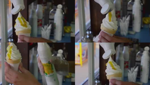厨师将华夫筒冰淇淋柠檬糖浆倒入高清在线视频素材下载