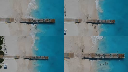 特克斯和凯科斯群岛，普罗维登夏莱斯，格雷斯湾码头的无人机上升空中高清在线视频素材下载