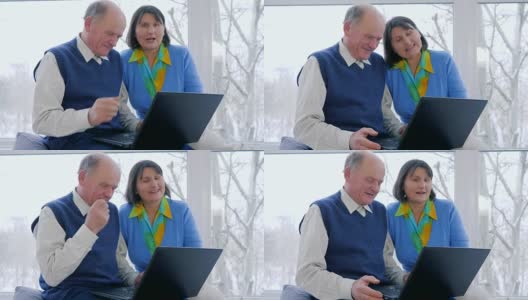 老年人视频通信，老年人在家里用笔记本电脑skype聊天高清在线视频素材下载