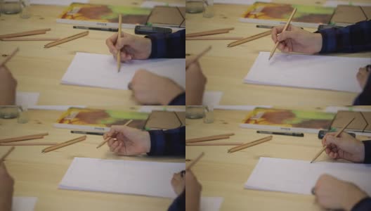 女人的手用铅笔在纸上画成一条线高清在线视频素材下载
