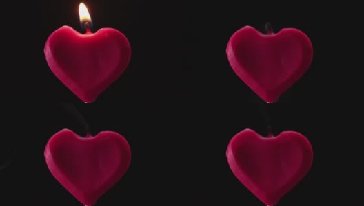 在黑色背景下吹灭红心蜡烛高清在线视频素材下载