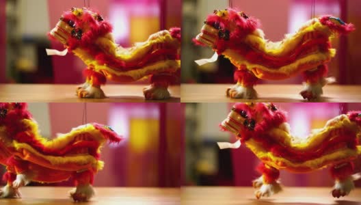 玩具中国狮子木偶侧面的狮子舞蹈高清在线视频素材下载