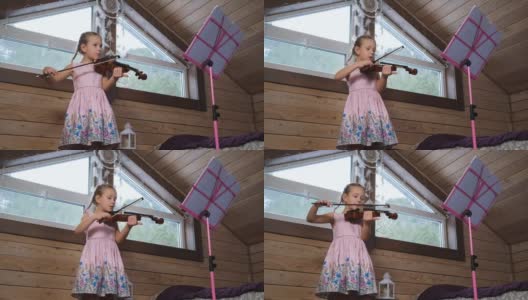小女孩在阁楼学拉小提琴高清在线视频素材下载