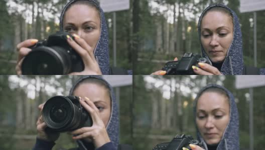 游客在森林中拍摄风景。一名白人女子近距离射击。女孩用无反光镜单反相机拍摄视频。高清在线视频素材下载