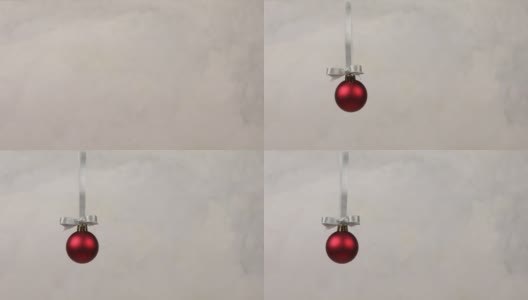 圣诞装饰球从镜框顶部落下高清在线视频素材下载