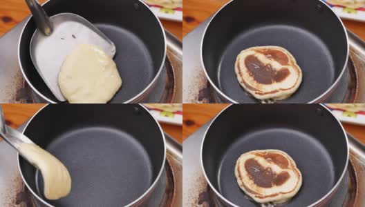 自制的煎饼在不粘锅上做美味的早餐。女性的手用锅铲在热锅上翻动煎饼。高清在线视频素材下载