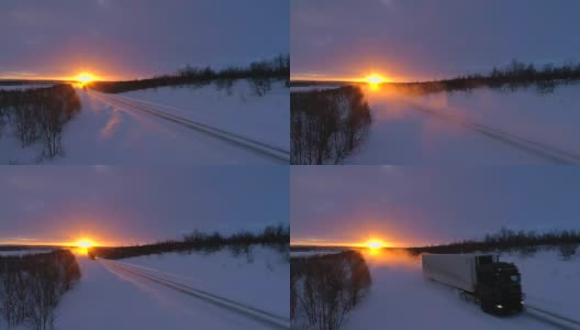 夕阳下，半挂车行驶在积雪覆盖的公路上高清在线视频素材下载