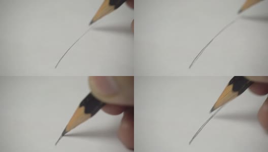 艺术家手持木制铅笔在白色水彩纸上作画- 4k高清在线视频素材下载