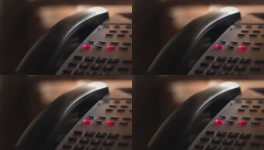 现代办公室电话键盘上有两条繁忙的座机线路在闪烁高清在线视频素材下载