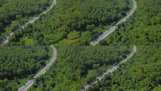 沿着乡村公路在田野上空飞行。在蓝天和白云的背景下。泰国高清在线视频素材下载