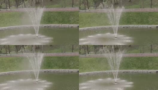 一个阳光明媚的日子，公园里的喷泉高清在线视频素材下载