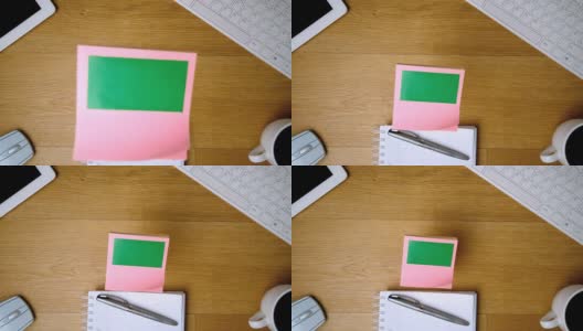 粉红色的色度键便签落在办公桌上高清在线视频素材下载