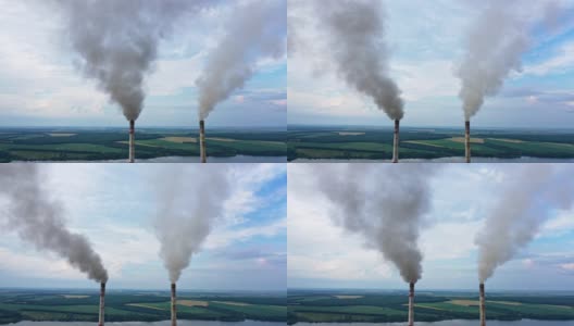 工业烟尘造成的大气污染。工厂产生化学烟雾的管道。浓烟和蒸汽污染环境。气候变化和全球变暖。高清在线视频素材下载
