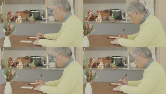 一名日本老人正在写新年贺卡高清在线视频素材下载