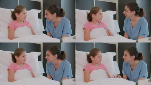 病床上的儿童病人在病房里与医生交谈高清在线视频素材下载