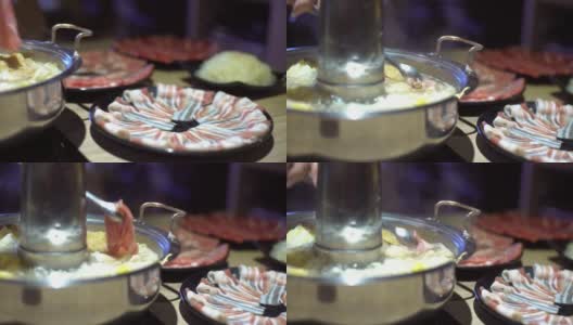 4K，传统北京风格的中国火锅和一个甜甜圈形状的黄铜锅。高清在线视频素材下载