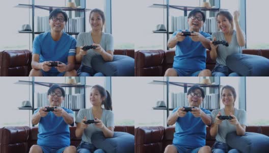 Old man and woman playing video game高清在线视频素材下载