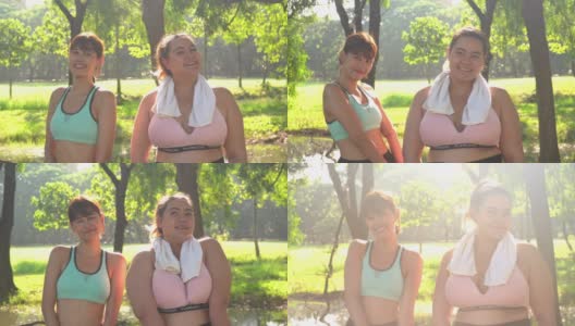 在一个公园里，一个身材高大的女性运动员和朋友微笑着高清在线视频素材下载