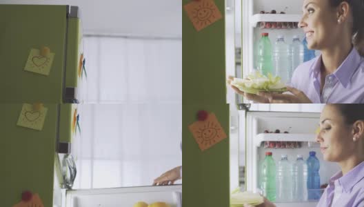 从冰箱里拿出健康蔬菜的女人高清在线视频素材下载