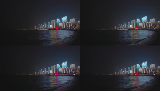 夜晚的时间照亮了青岛市区著名的奥林匹克湾，时光流逝4k中国全景高清在线视频素材下载