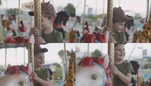 可爱的小男孩喜欢在游乐场玩旋转木马高清在线视频素材下载