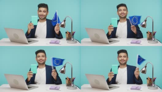 西装革履的商人面带微笑，挥舞着欧盟旗帜，开心地出国旅行，庆祝欧洲日高清在线视频素材下载