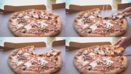 女手拿着一片热的披萨，有拉伸奶酪，有火腿、蘑菇和奶酪的蓬松披萨，女手拿着一片披萨高清在线视频素材下载