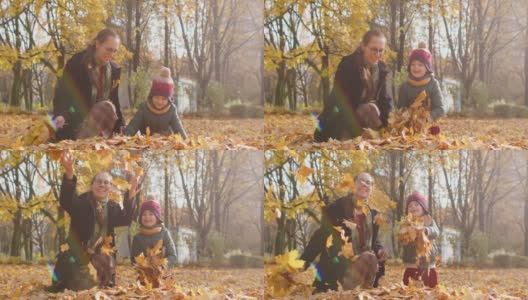 一个阳光明媚的秋日，一家人在公园里扔树叶高清在线视频素材下载