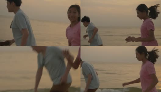 亚洲儿童在沙滩上奔跑，伴以日出为背景，积极的生活理念。高清在线视频素材下载