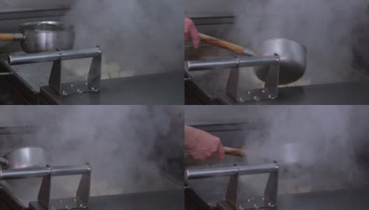 慢动作煎锅贴。厨师在铁锅上煎饺子高清在线视频素材下载