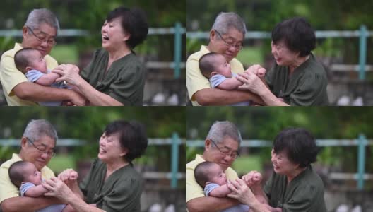 一对亚洲华人老夫妇和他们的孙子在自家前院玩高清在线视频素材下载