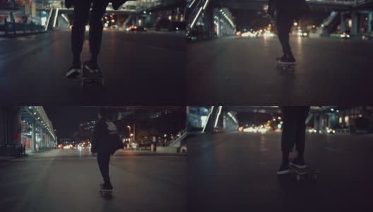 年轻人晚上沿着城市街道玩滑板高清在线视频素材下载