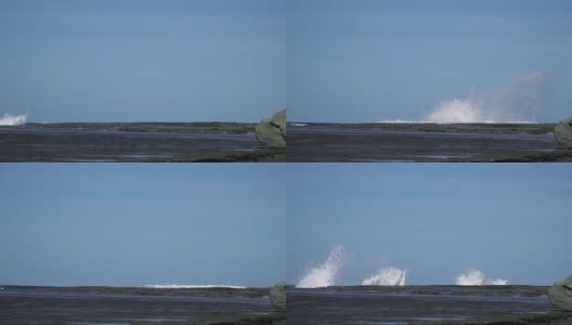 慢镜头海浪撞击海岸岩石，溅起巨大水花高清在线视频素材下载