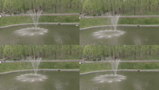 一个阳光明媚的日子，公园里的喷泉高清在线视频素材下载