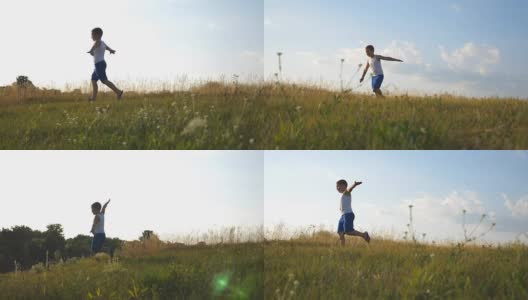 在阳光明媚的日子里，小男孩举起双手在草地上奔跑。孩子在草坪上慢跑。快乐的微笑的男孩有乐趣在一个夏天的草地上的自然。慢镜头高清在线视频素材下载